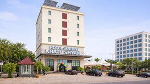 A hotel with a sign reading 'HOTEL SURBHI KHATU SHYAM,' featuring a modern design with solar panels on the roof and a prominent entrance. - Hotel Surbhi Khatu Shyam (Danta Ramgarh)