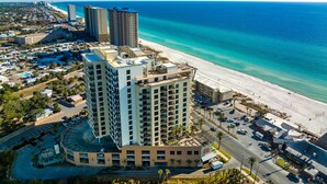 A high-rise hotel with a rooftop pool, adjacent to a beach and ocean. - Origin 1115 | Cozy studio, steps to beach + free activities (Panama City Beach)