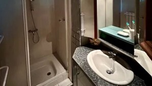 A modern bathroom with a glass shower enclosure, a sink with a marble countertop, and a large mirror. - Vacation home in Andernos-les-Bains - Sleeps 6 - Near beach and market (Andernos-les-Bains)