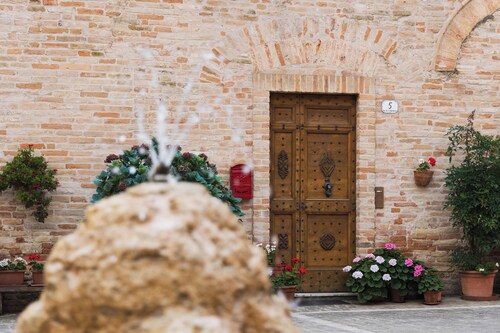 Historic home overlooking the main square in an Italian village