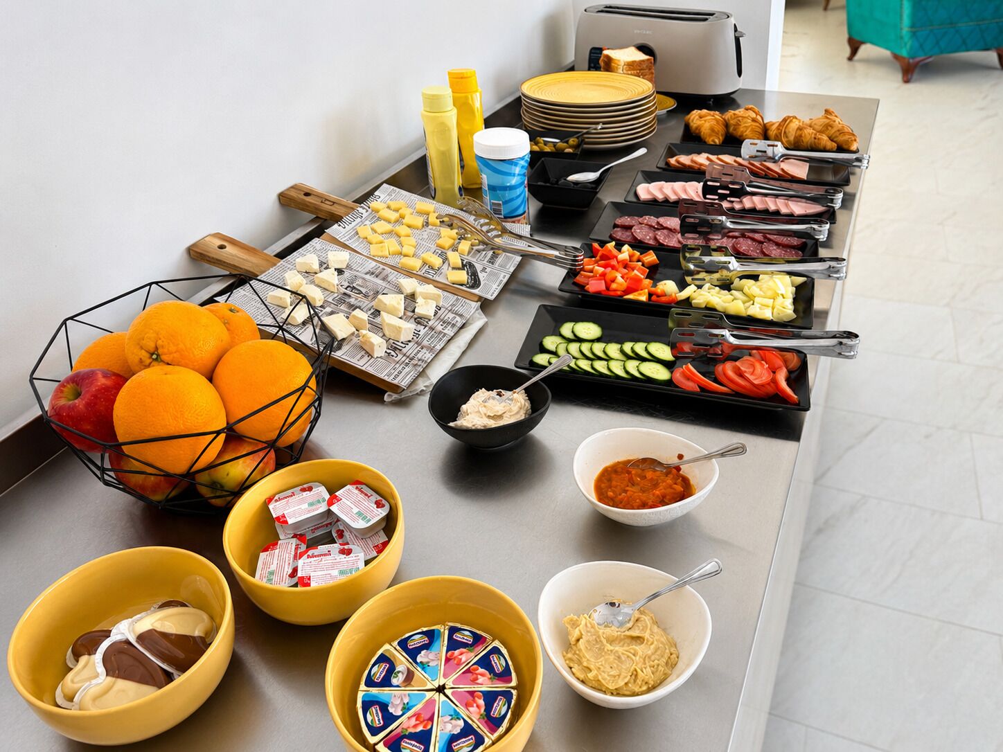A buffet with various food items and condiments.