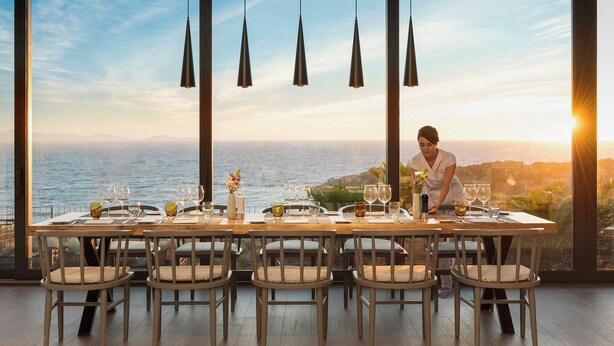 A dining table set for six with a view of the ocean. - 4 Bedrooms & 1 Living Room  Pool Villa Seaview (Bodrum)