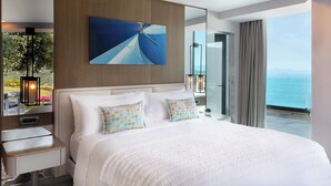 A modern hotel room with a large bed, a flat-screen TV, a bedside table, and a view of the ocean. - 4 Bedrooms & 1 Living Room  Pool Villa Seaview (Bodrum)