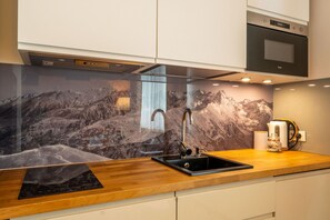 Apartment | Private kitchenette | Fridge, microwave, stovetop, dishwasher
