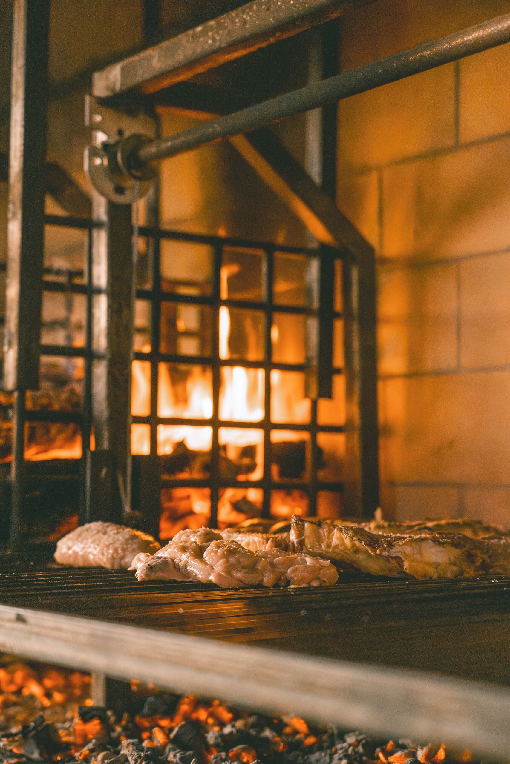 A grill with food being cooked over an open flame.
