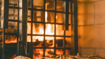 A grill with food being cooked over an open flame.