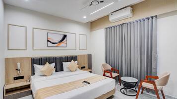 Deluxe Double Room, City View | In-room safe, desk, laptop workspace, iron/ironing board