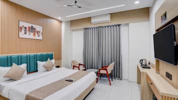 Deluxe Double Room, City View | In-room safe, desk, laptop workspace, iron/ironing board
