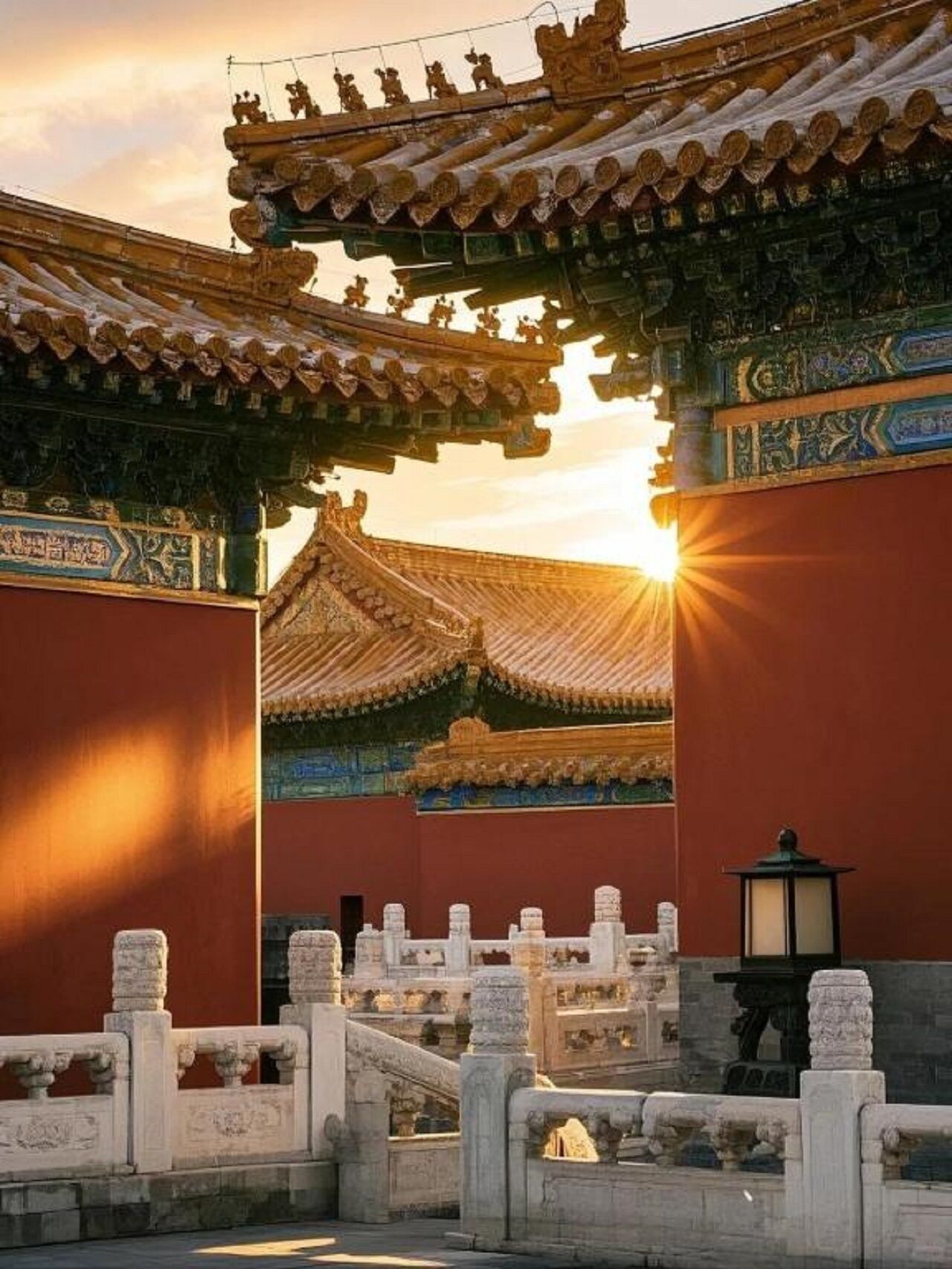 A traditional architectural structure with ornate roof tiles and a stone balustrade.