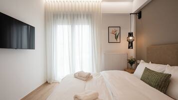 Apartamento superluxo | Roupas de cama premium, cofres nos quartos, individualmente decorados