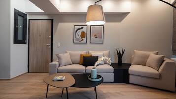 Luxury Apartment | Living area | 40-inch flat-screen TV with digital channels