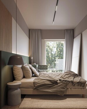 Una camera da letto moderna con un letto, un comodino, una lampada e vista sugli alberi dalla finestra.