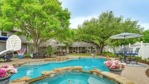 A backyard with a swimming pool, stone steps, and outdoor furniture. - Backyard Bungalow w/ Pool & Country Views (Argyle)