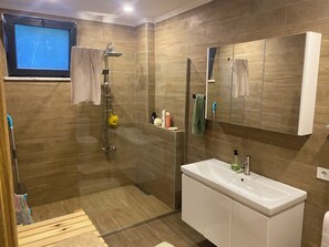 Shower, hair dryer, towels, soap