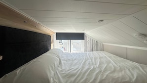 A bedroom with a bed, a window, and a ceiling with recessed lighting. - Self-catering Lodge Inverness - Sleeps 4 (Inverness)