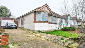 A two-story house with a garage, a driveway, and a small garden area. - 3 Bed House Near Epping Forest Greater London (London)