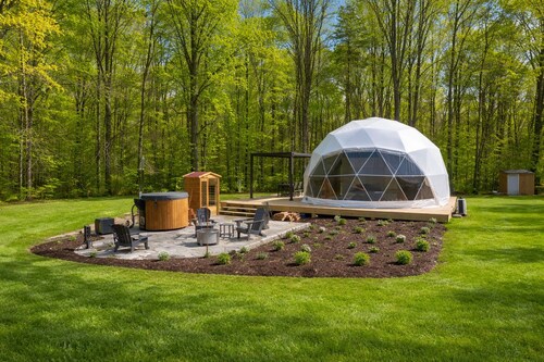 One of kind wellness/glamping experience with wellness amenities, covered outdoor dining, a complete live fire cooking setup, and a clear star gazing top.