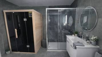 Shower, hair dryer, towels, soap