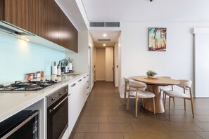 Fridge, microwave, oven, stovetop - Waterfront Lagoon Suite: 1 Bed Apt (Darwin)