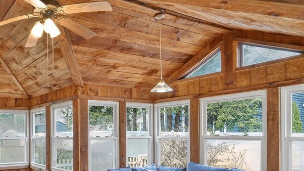 A wooden interior with a sofa, tables, and a ceiling fan. - Saratoga Cottage 2br Near Track & Lake 2 Bedroom Home (Saratoga Springs)