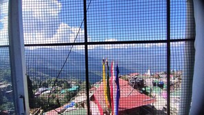 Quarto triplo luxo, vista para a cidade | Vista do quarto