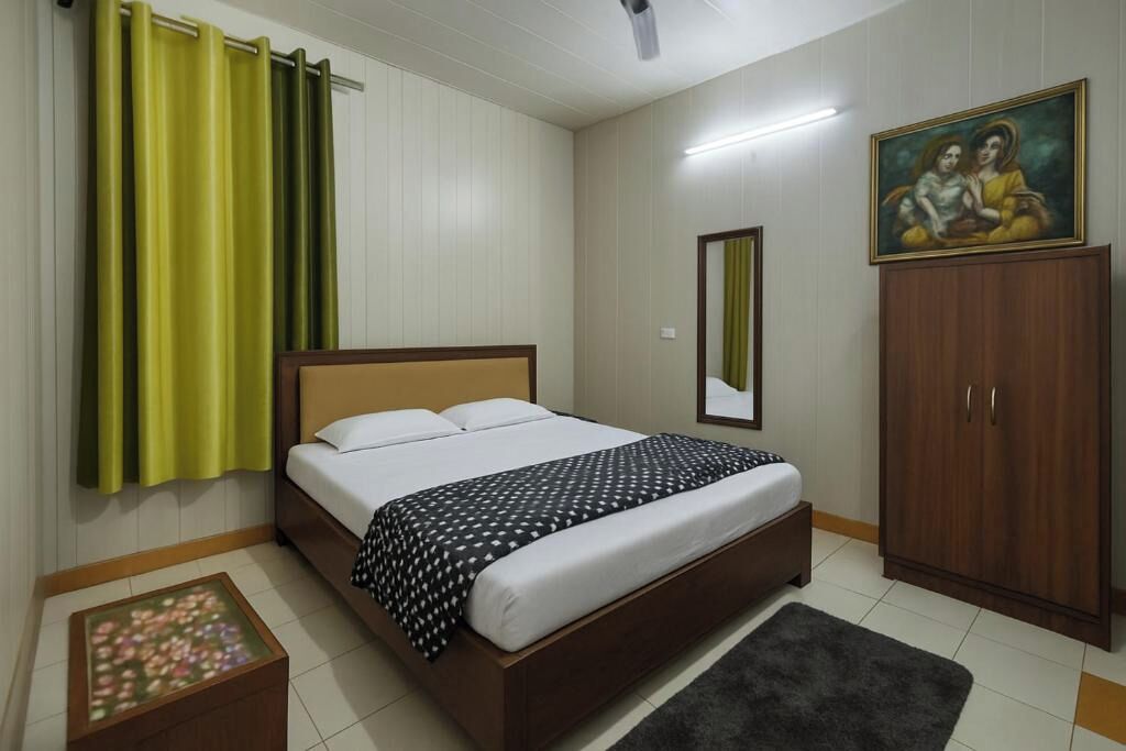 A bedroom with a bed, a wooden wardrobe, a mirror, and a painting on the wall.