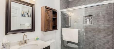 Shower, hair dryer, towels, shampoo