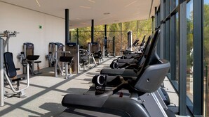 A modern gym with treadmills, elliptical machines, and weight equipment. - LAS COLINAS GOLF (Dehesa de Campoamor)
