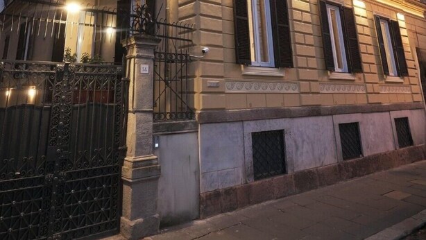 A multi-story building with a classic architectural style, featuring balconies and a gated entrance. - Rishon (Rome)