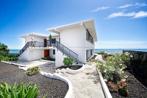 A modern two-story house with a balcony, a staircase, and a view of the ocean. - 1.4 Amapola Ocean -recently renovated, ocean front (Maspalomas)