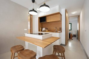 Fridge, microwave, stovetop, coffee/tea maker