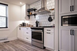 Fridge, coffee/tea maker, cookware/dishes/utensils