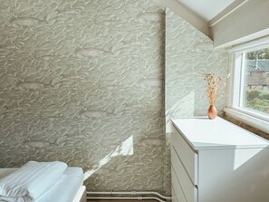 Room - A boutique coastal lodge between sea and forest, personally managed by Dutch Sweet Home. With a fireplace, sunny garden and serene atmosphere — created for slow living and true relaxation. (Warmenhuizen)