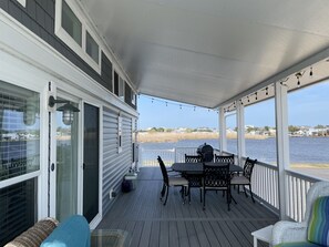 Outdoor dining - Coastal Chic Back Bay Waterfront Tiny Home Steps Away From Sandbridge Beach (Virginia Beach)