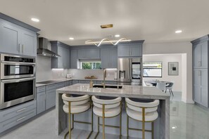 Fridge, microwave, oven, stovetop - Modern Oasis: Hot Tub, Fire Pit, 3 Mi to Beach (Clearwater)