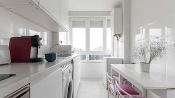 Microwave, oven, dishwasher, dining tables