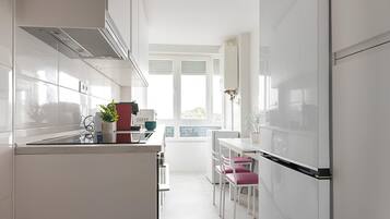 Microwave, oven, dishwasher, dining tables
