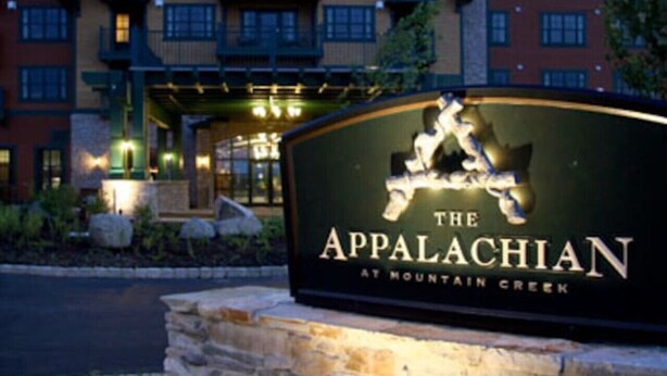 A hotel sign with a mountain and a horse, indicating 'The Appalachian at Mountain Creek.'