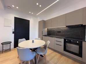 Family Apartment, Patio | Private kitchen - BlueMotion - CruiseNest Double (Pireas)