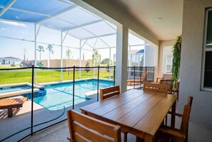 Outdoor dining - 6BR Home w/ Pool, Theater & Game Room (Davenport)