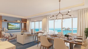 Una sala de estar moderna con comedor, ventanas amplias con vistas al océano, televisor de pantalla plana y candelabro.