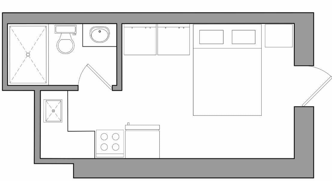 A floor plan with a kitchen, a bathroom, and a large living area.