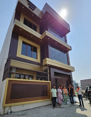 A modern building with a sign reading 'SIDDHI PALACE.' - Hotel Siddhi Palace (Ayodhya)