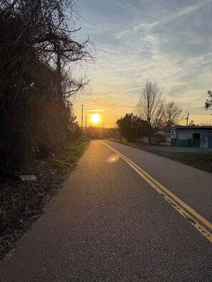 A road with a clear sky and the sun setting or rising in the distance. - 2 minute free ride to Shinnecock Golf US Open (Southampton)