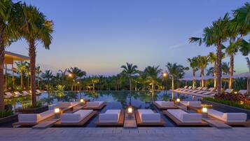 A poolside area with lounge chairs and a clear view of the pool.