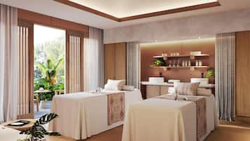 A hotel room with two beds, a bathroom with shelves, and large windows.
