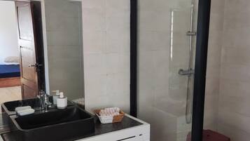 Shower, towels, soap, toilet paper