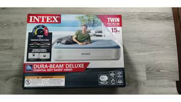A box of Intex Twin 15-inch Dura-Beam Deluxe mattresses.