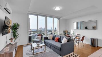 Departamento, 1 cama Queen size y sofá cama, para no fumadores, cocineta | Área de sala de estar