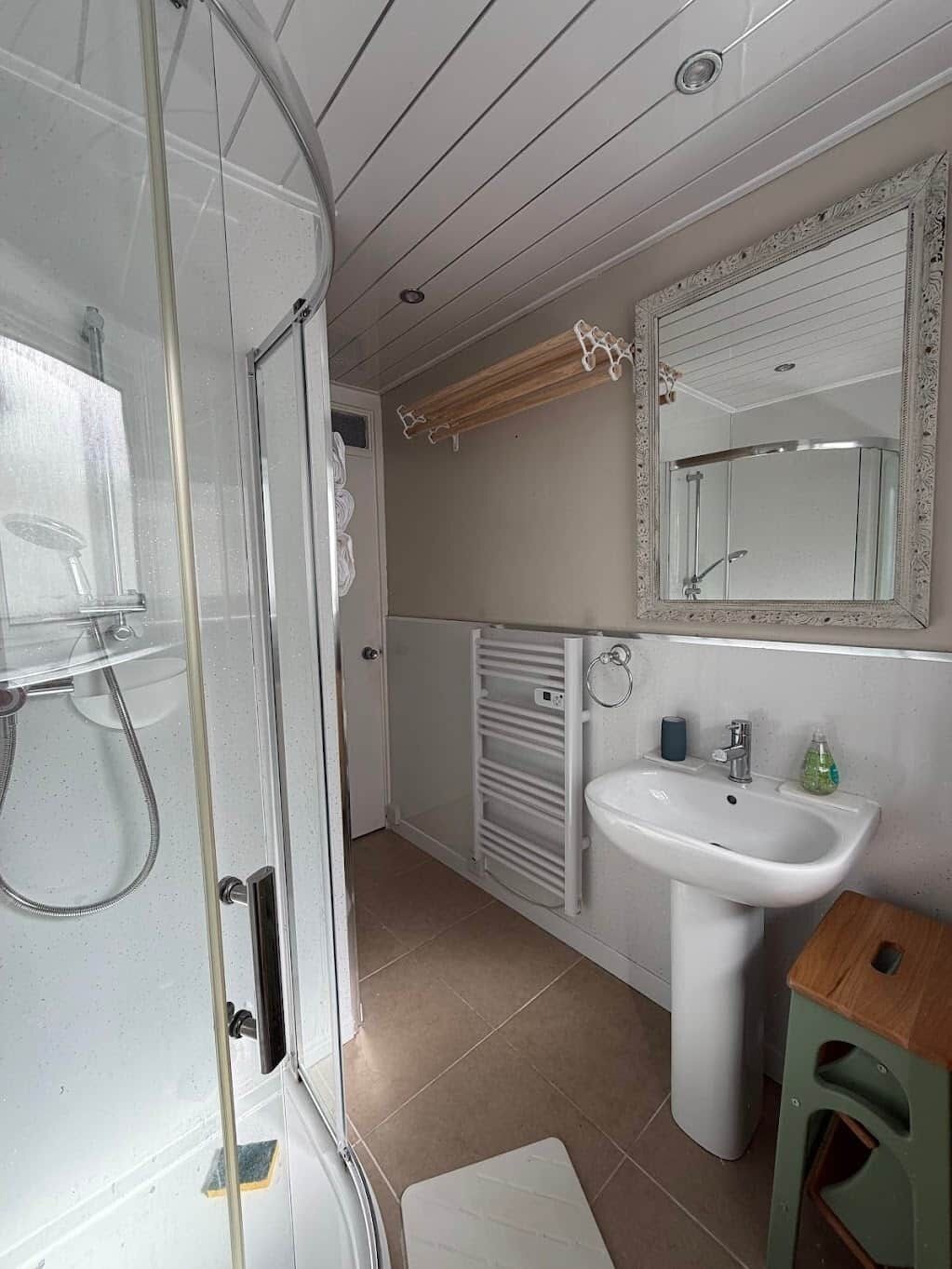 Shower, hair dryer, soap, toilet paper